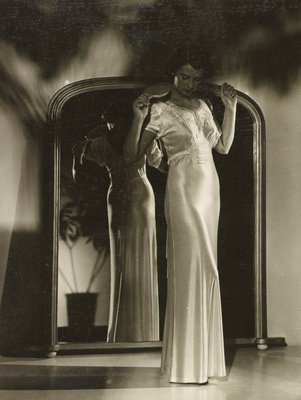 Alternate image of recto: Untitled (cutting English FINTEC)
verso: Untitled (woman looking down in white nightgown in front of mirror) by Max Dupain
