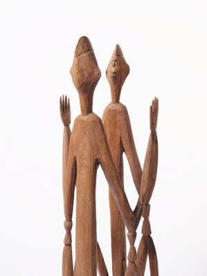 Alternate image of Male and female ancestor figures by Asmat people