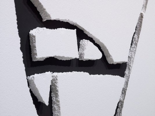 Alternate image of White Styrofoam on black wall by Sol LeWitt