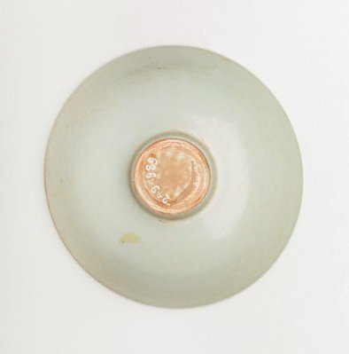 Alternate image of Shallow bowl on small foot decorated with incised design of two dragons around flaming pearl by Jingdezhen ware