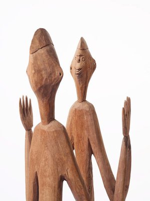 Alternate image of Male and female ancestor figures by Asmat people