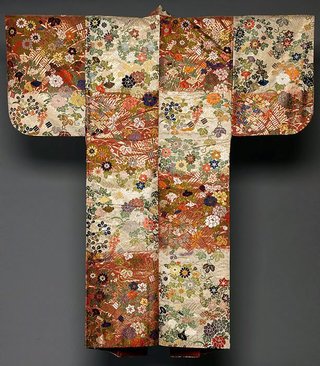 AGNSW collection 'Karaori' nō robe with design of flowers of the four seasons on sectioned red-and-white background 19th century