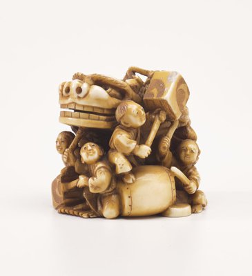 Alternate image of Netsuke in the form of a festival group with a mask, drums and lanterns by Kōgetsu