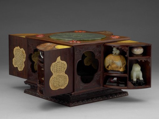	Qianlong 1736–95, Qing dynasty 1644–1911, 'Square curiosity box with multiple treasures’, wood, jade, bronze, amber, agate, ink on paper, 19.9 × 25.4 × 25.2 cm (box), National Palace Museum, Taipei. Photo: © National Palace Museum, Taipei